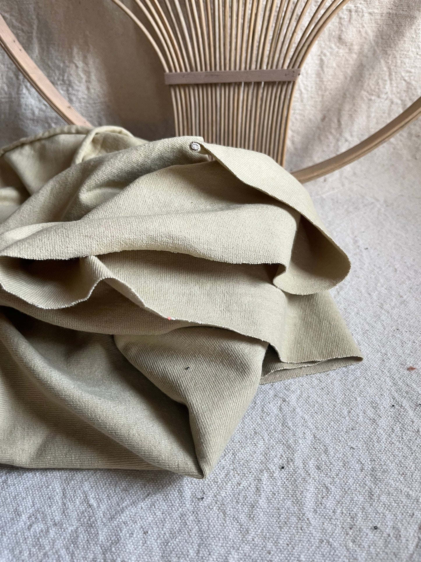 Beige fabric draped, detail of 158357A5-2ECF-4F8C-A4F4-2493A6C86FBA