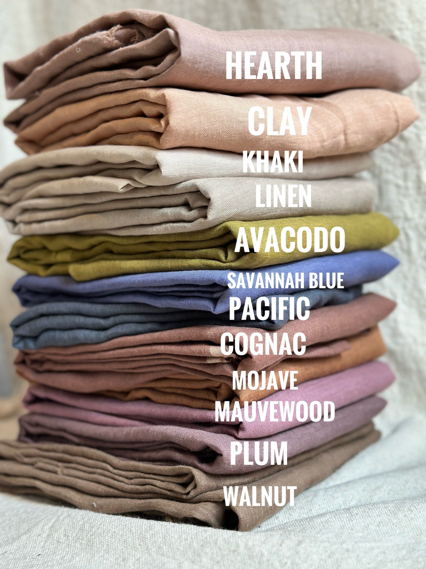 Stack of colorful linen fabric samples