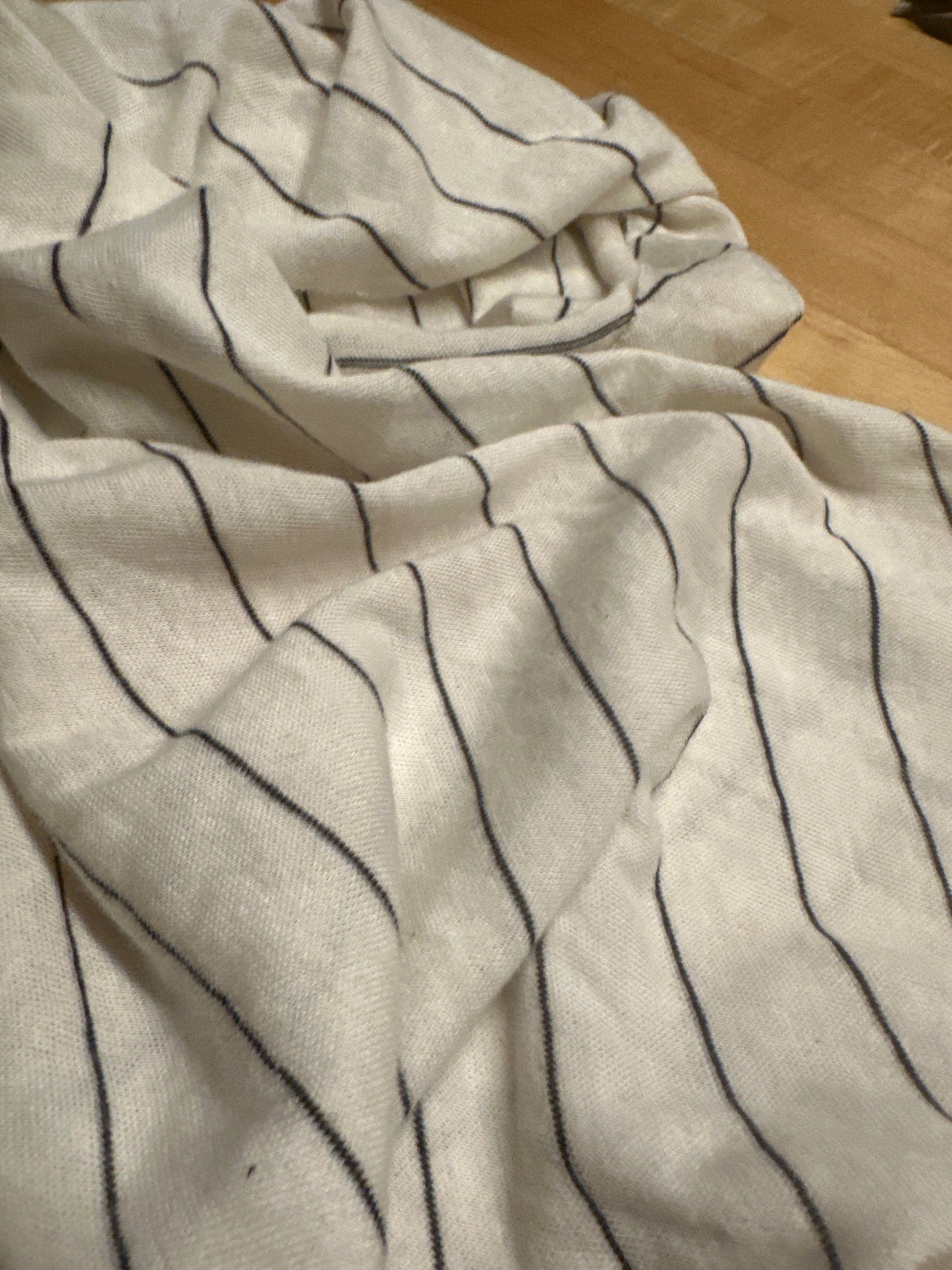 White fabric with black stripes, detail view (5D9F8C80-E5C5-473D)