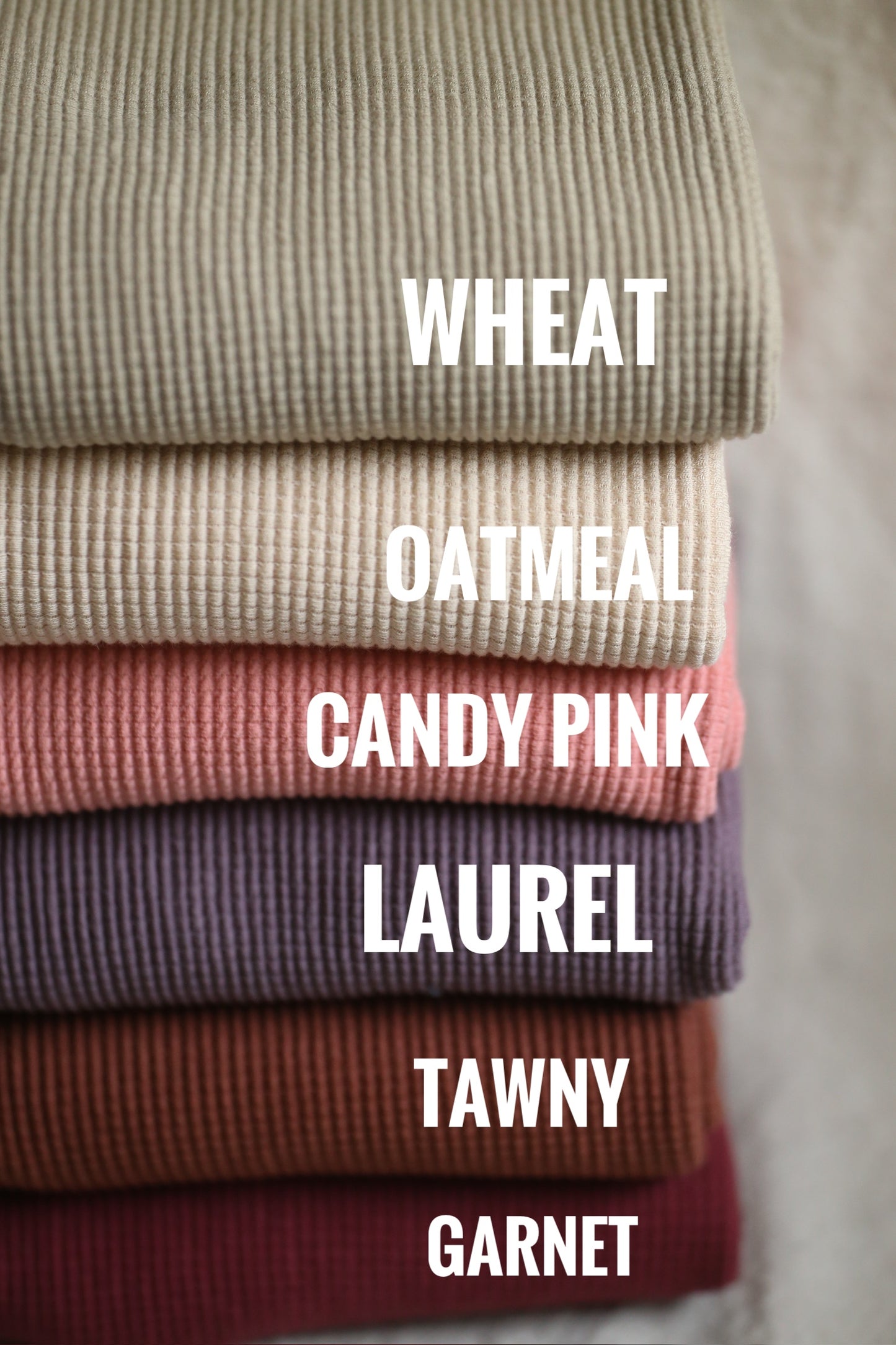 Pile of fabric in various colors (Wheat, Oatmeal, Candy Pink, etc.)