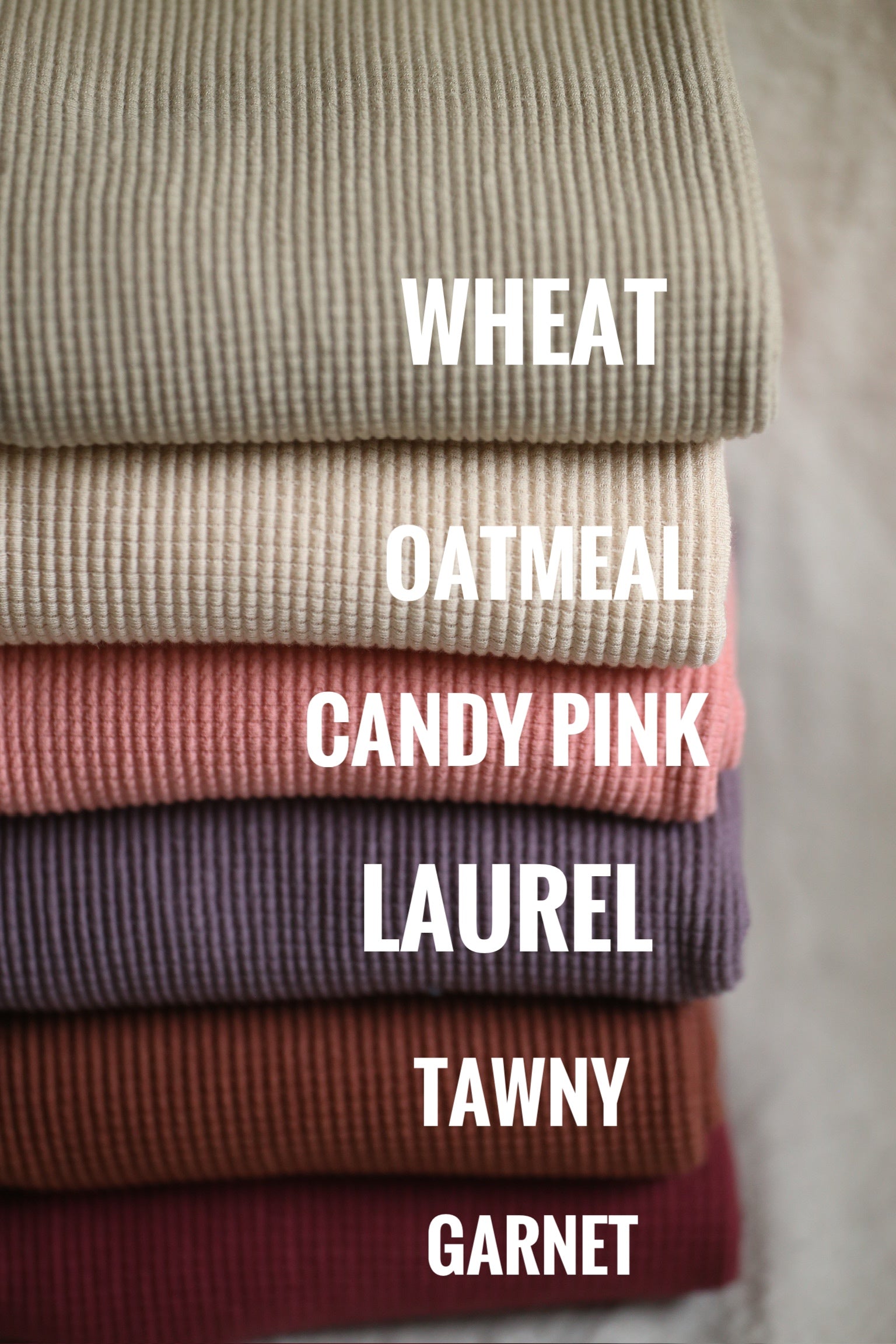 Pile of fabric in various colors (Wheat, Oatmeal, Candy Pink, etc.)