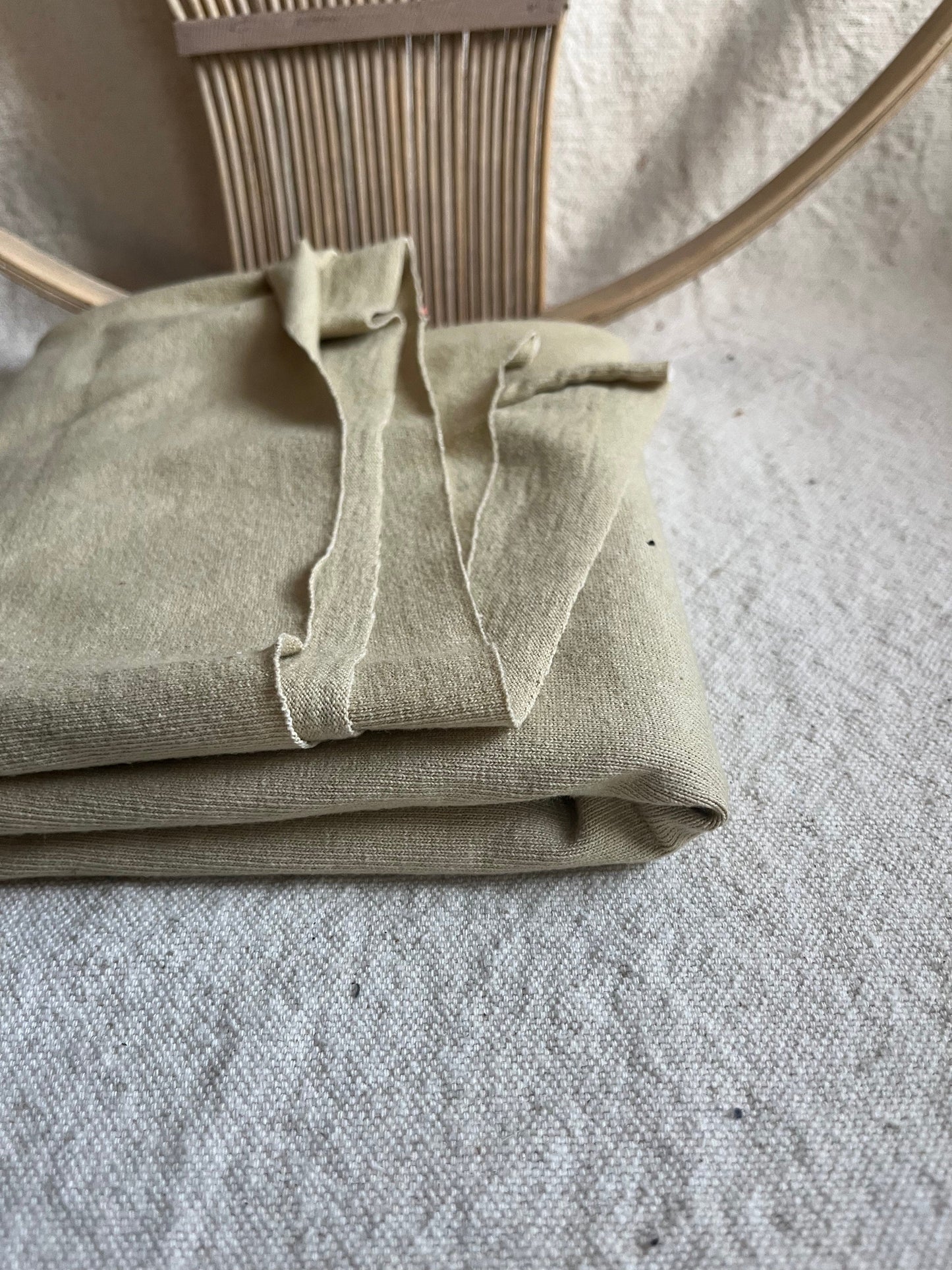 Folded beige fabric with decorative frame - DE5F4B82-6B3E-46F8-A2B4-32019362EF35