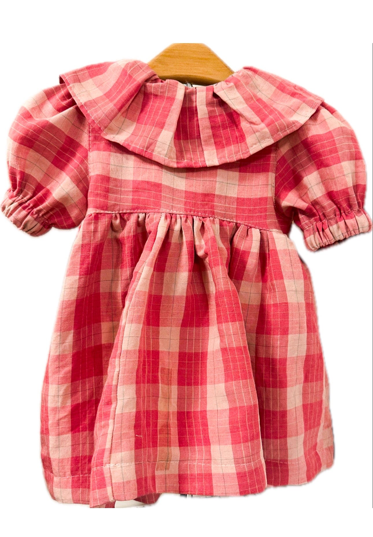 Pink gingham dress on hanger