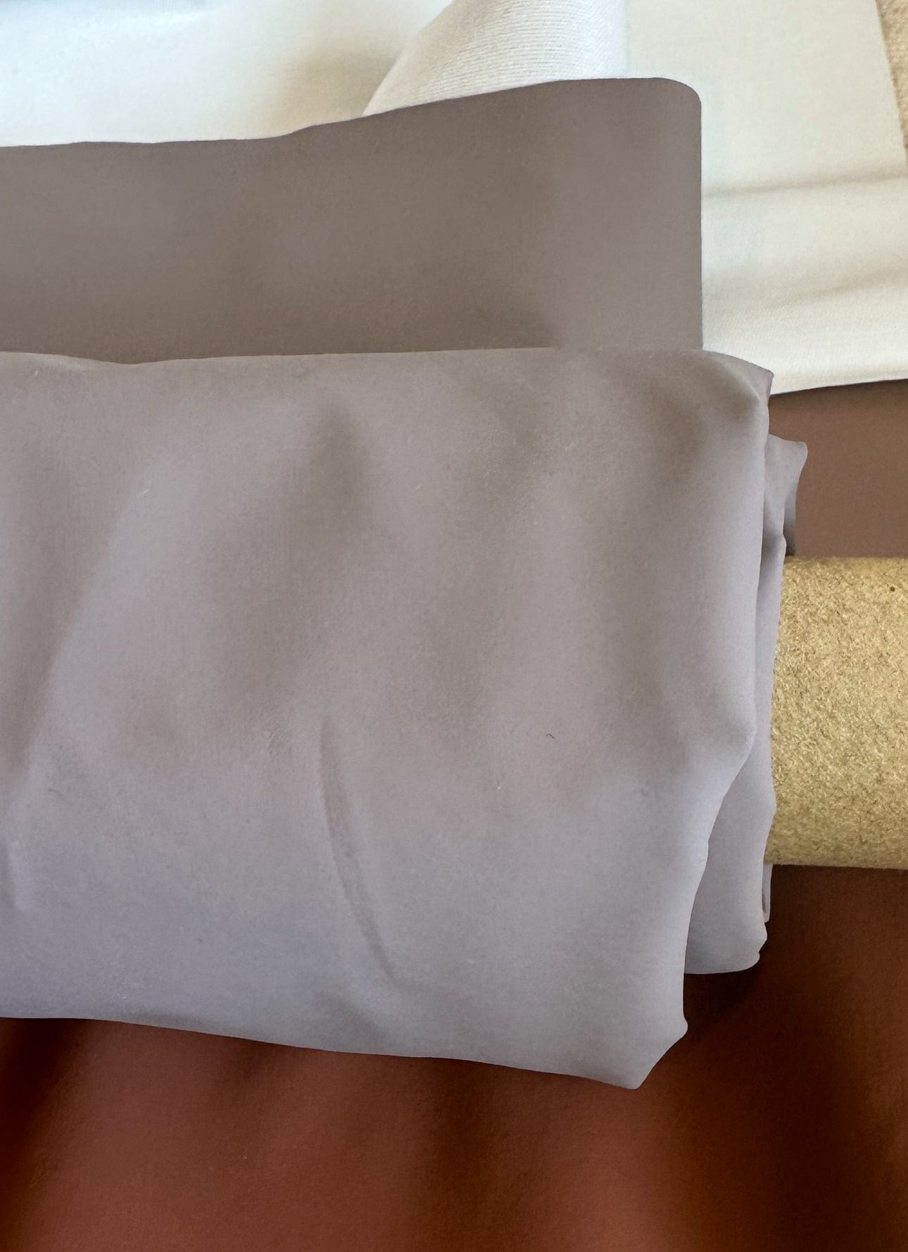 Close-up of fabric rolls in various colors, FullSizeRender