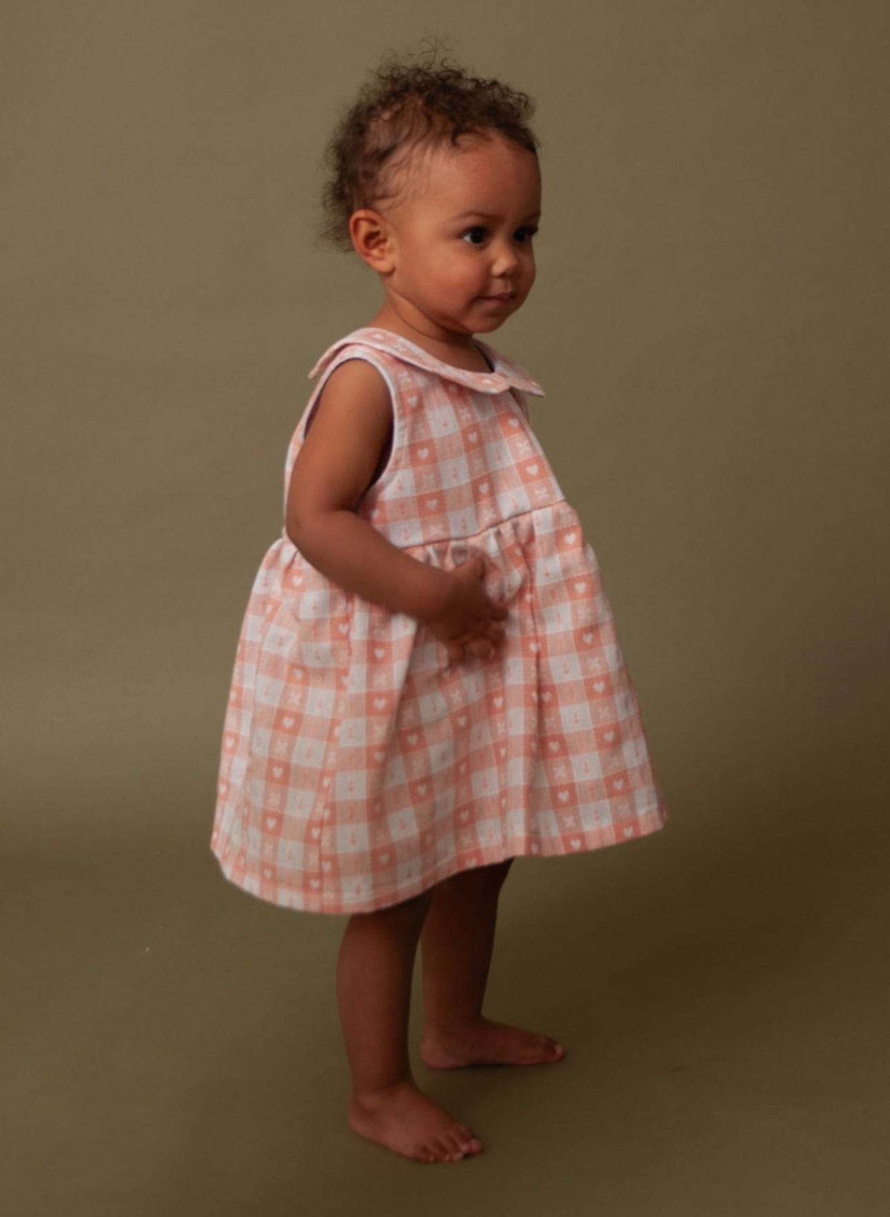 Baby girl in plaid dress