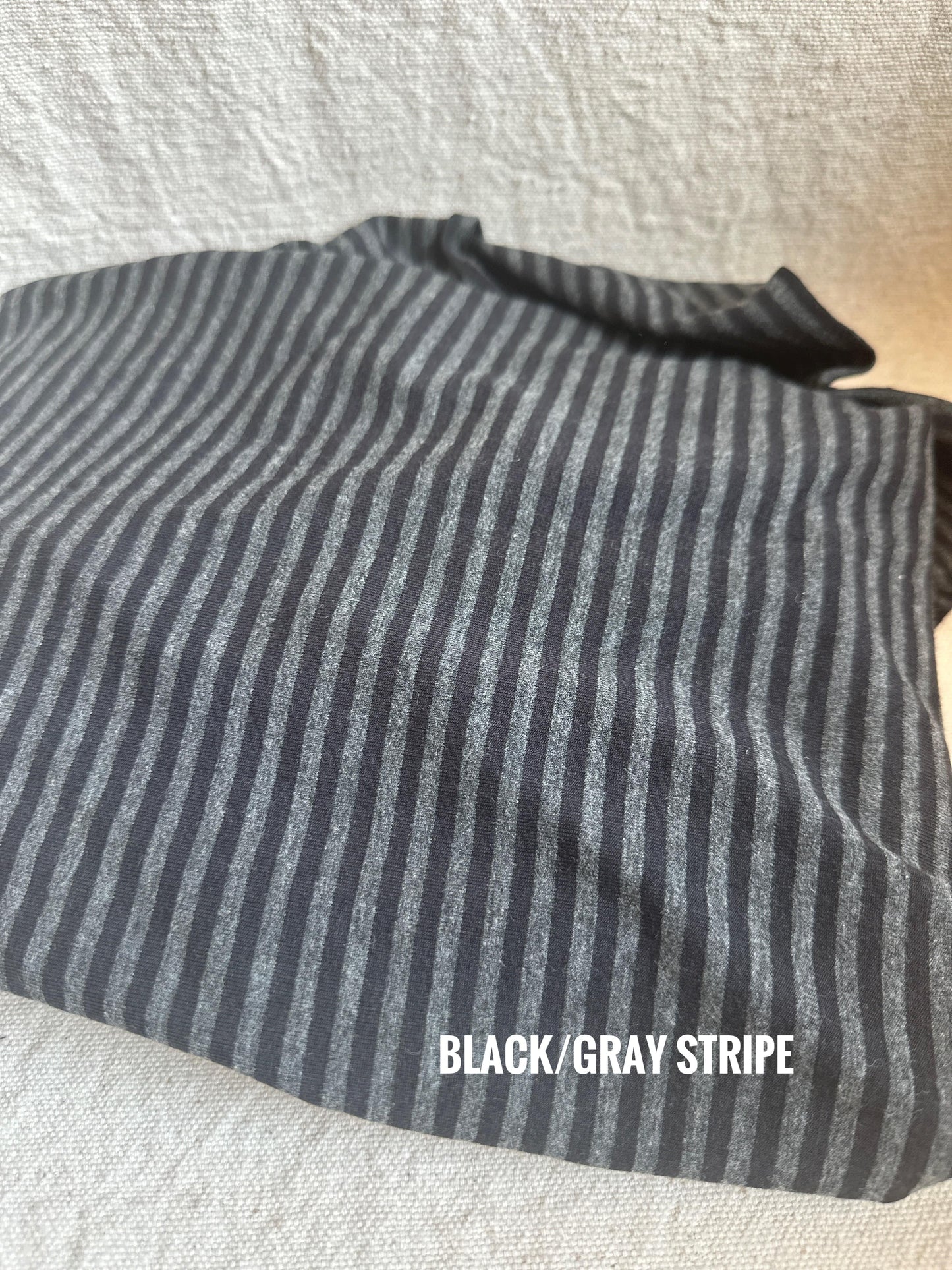 Black and gray striped fabric detail