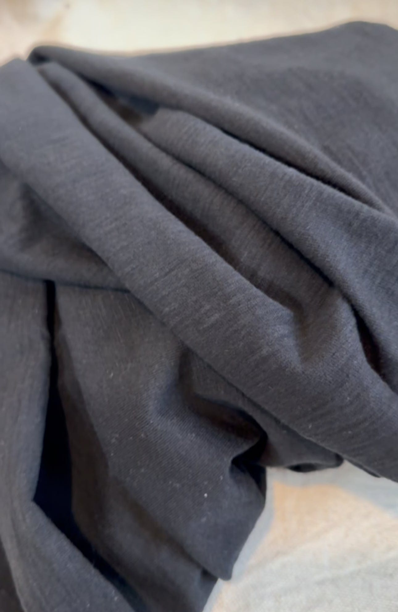 Close-up of dark gray fabric, FullSizeRender