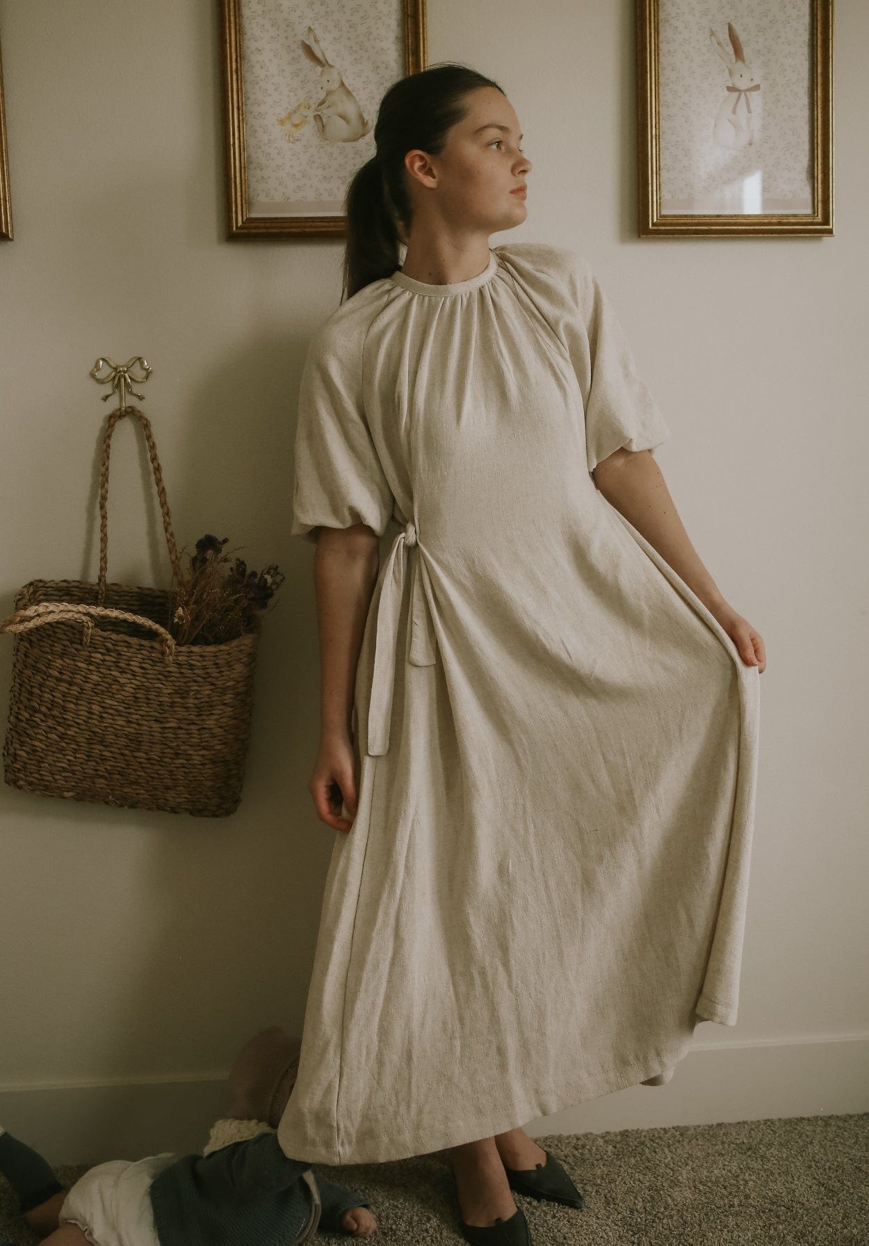 Woman in beige dress, FullSizeRender