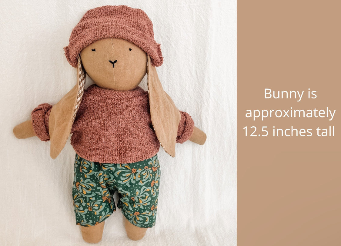 Handmade bunny doll in hat and shorts