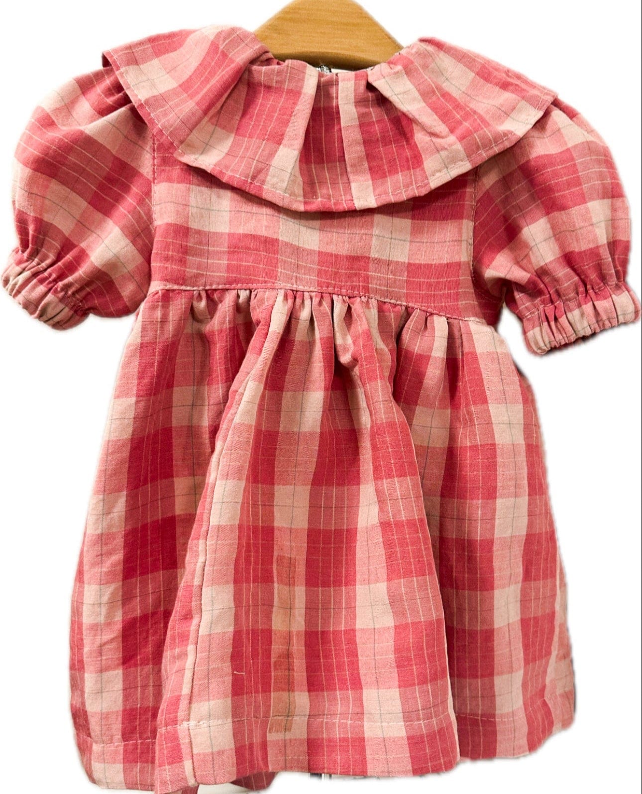 Pink plaid dress on hanger