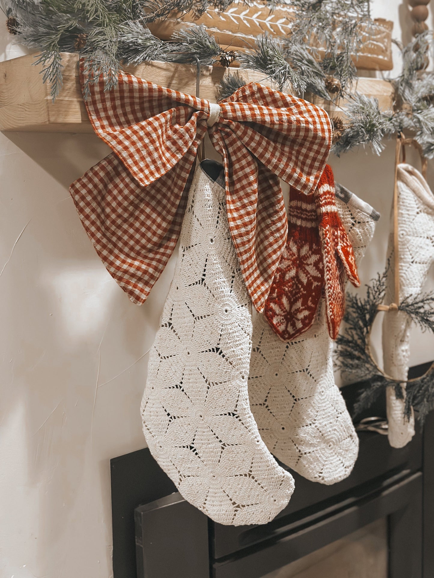 Christmas stockings hanging on a mantel.