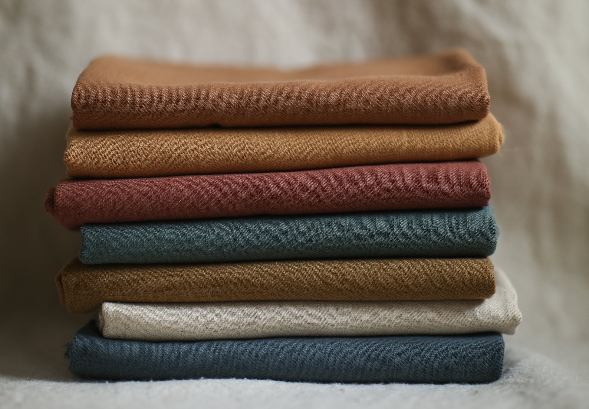 Stack of folded, colorful fabric.
