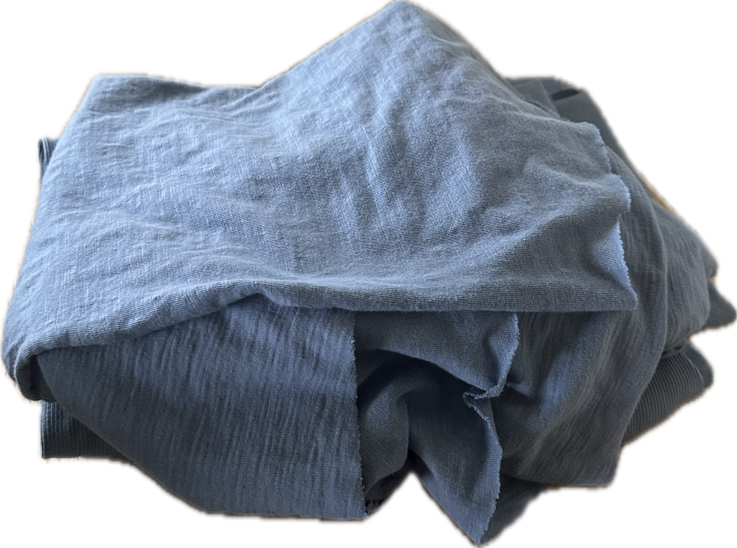 Blue fabric folded in a pile.