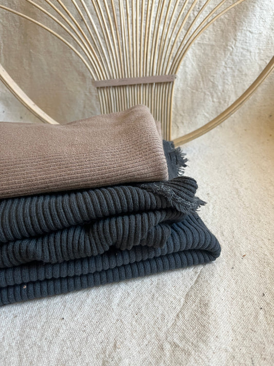 Stacked corduroy fabric with woven background.