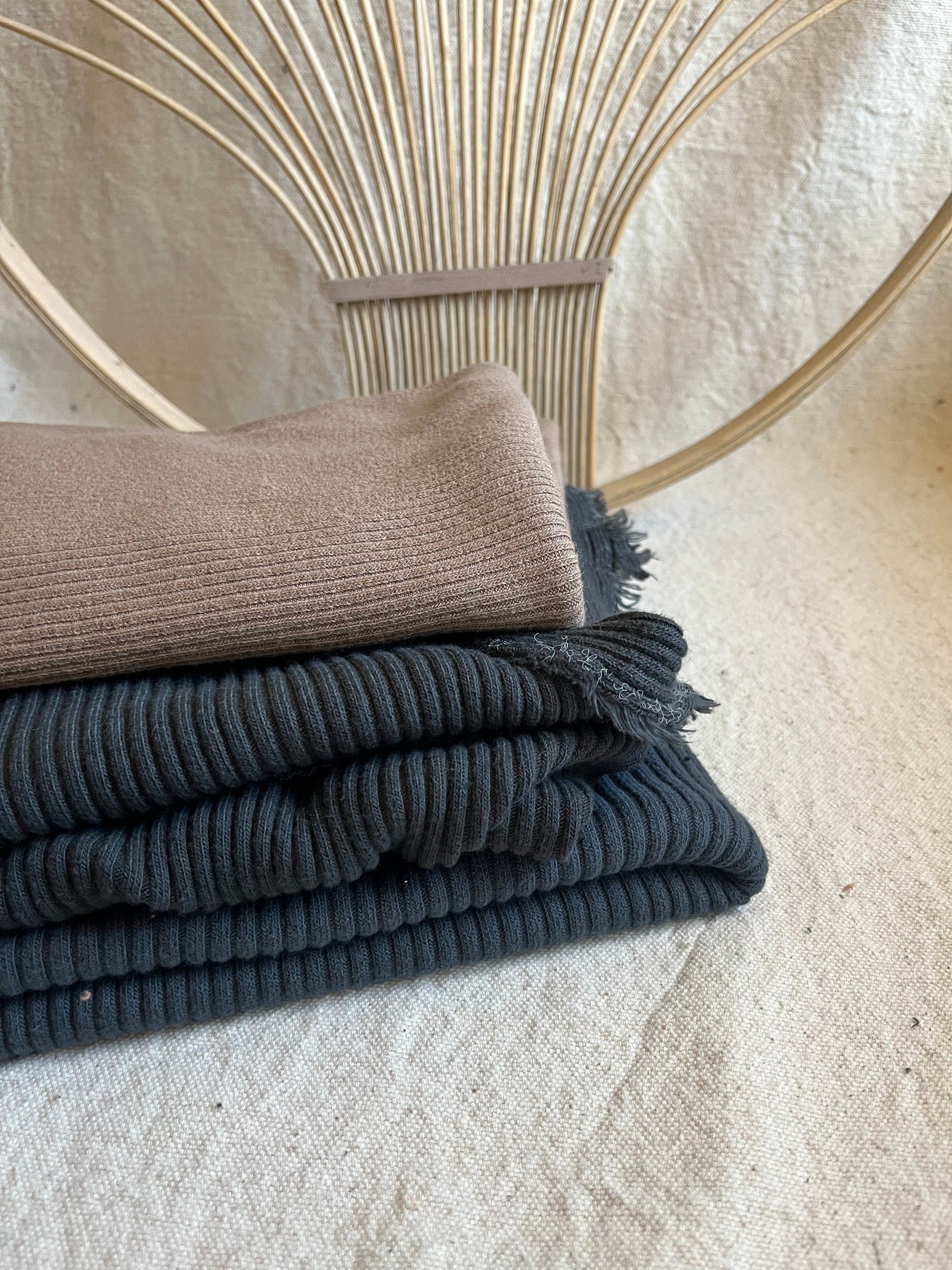 Stacked corduroy fabric with woven background.