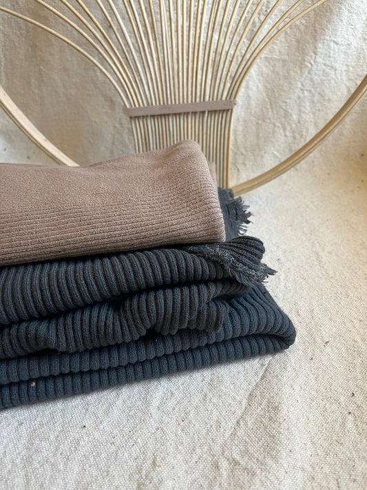Stacked corduroy fabric with woven background.