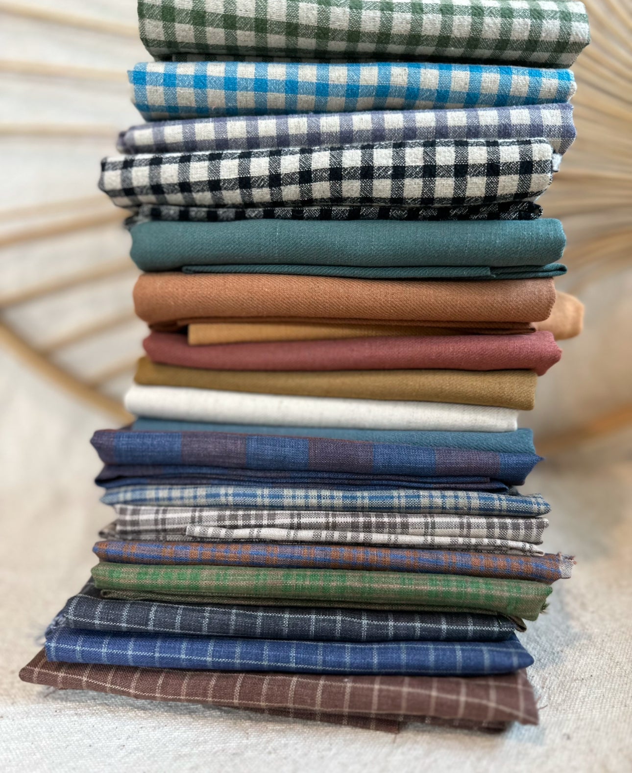 Pile of colorful fabric rolls.