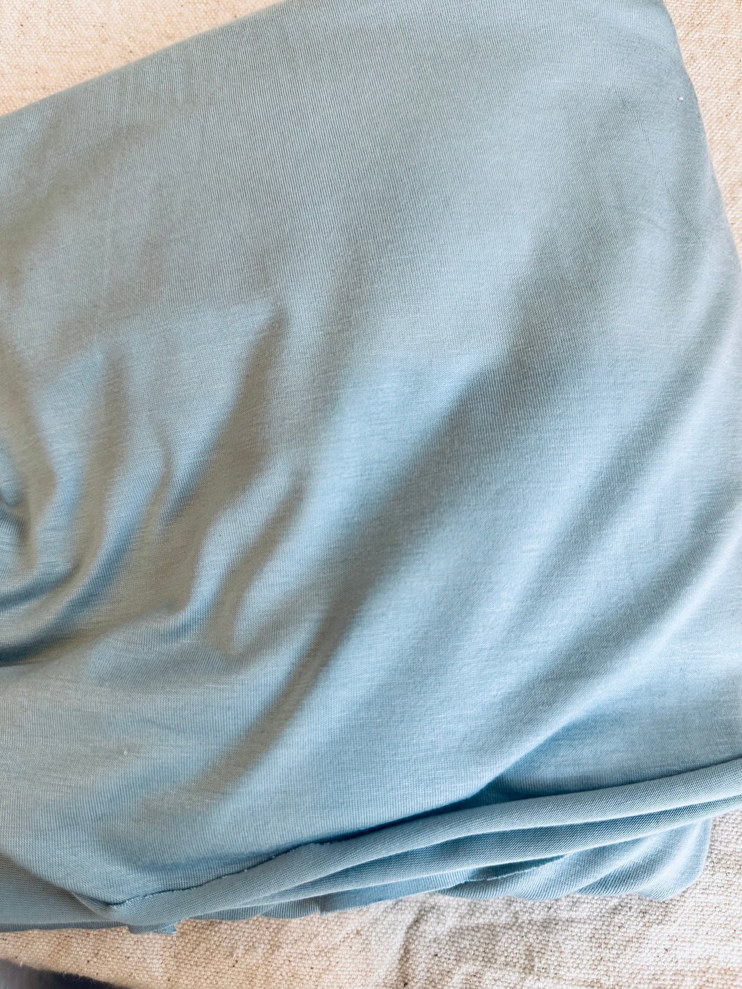 Blue fabric with folds.