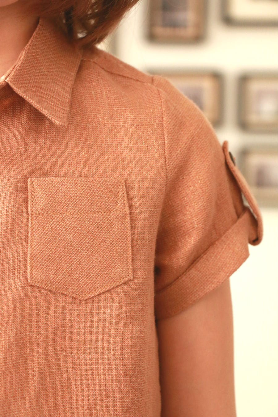 Close-up of a peach-colored linen shirt with pocket