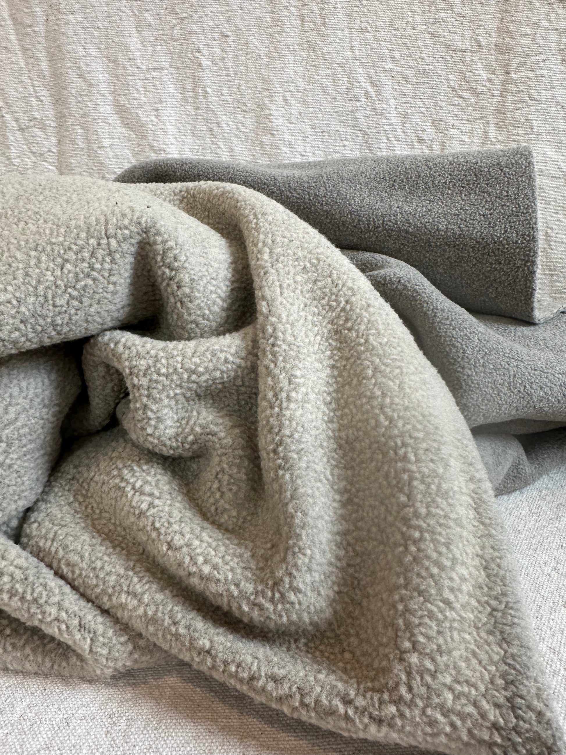 Extra heavyweight 21 oz Teddy Bear Polar Fleece fabric folded to show thick plush texture, perfect for sewing jackets, blankets, robes, and cozy winter DIY projects. Ultra-soft fleece fabric with brushed teddy bear finish, 58–60 inches wide, sold by the half yard, ideal for warm, durable sewing