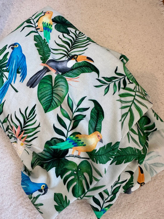 Fabric with tropical birds and leaves.